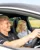 Pro Driver and passenger inside a Mercedes-AMG 63 during a high-speed ride at Mercedes-Benz World, capturing excitement and elite performance.